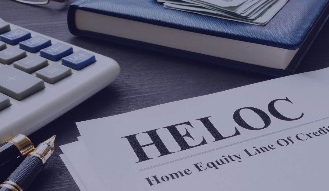 A busy desk scene with calculator and home equity line of credit notes